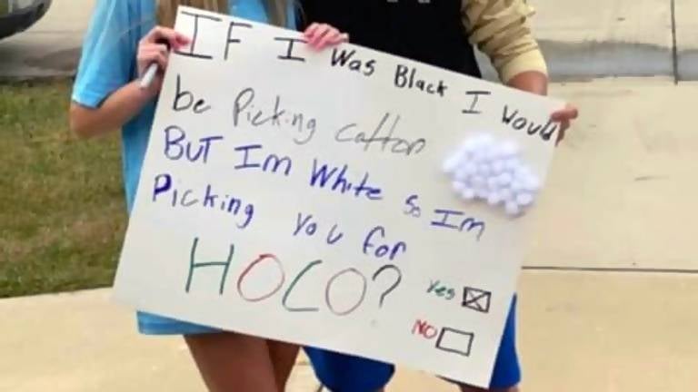 Viral Photo Shows White Kansas High Schoolers Posing with Racist Homecoming Proposal Sign