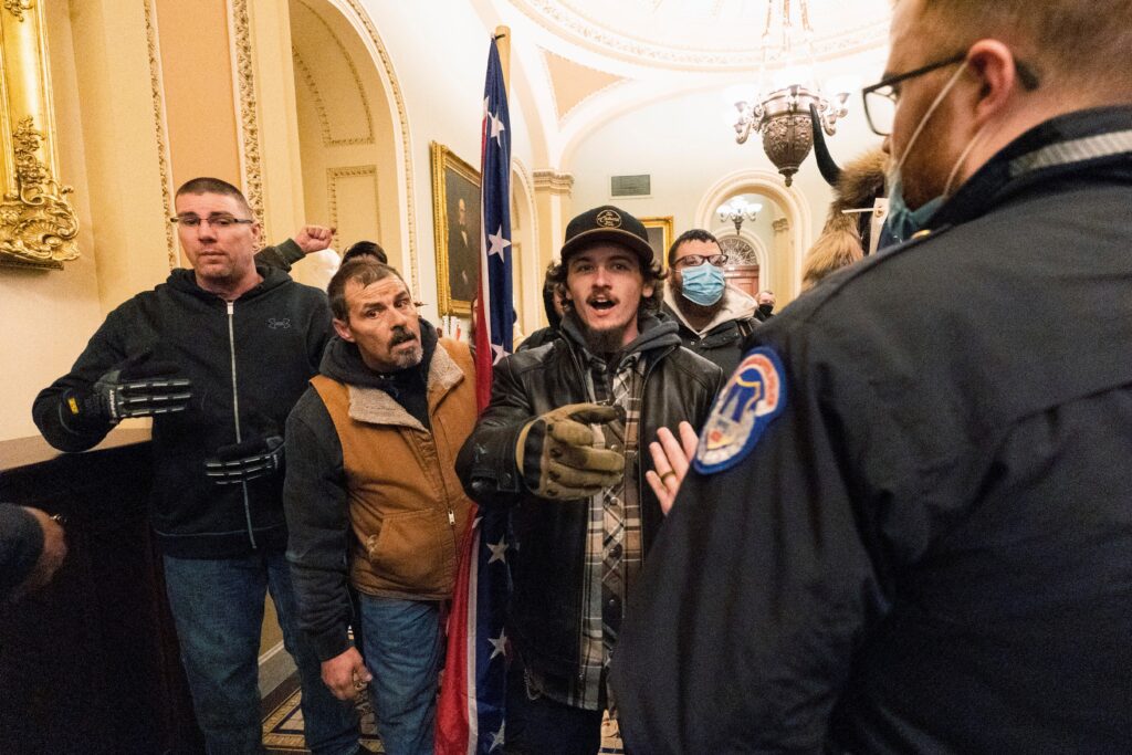 Judge Will Decide Trial For Dad And Son Who Carried Confederate Flag At Capitol Riot