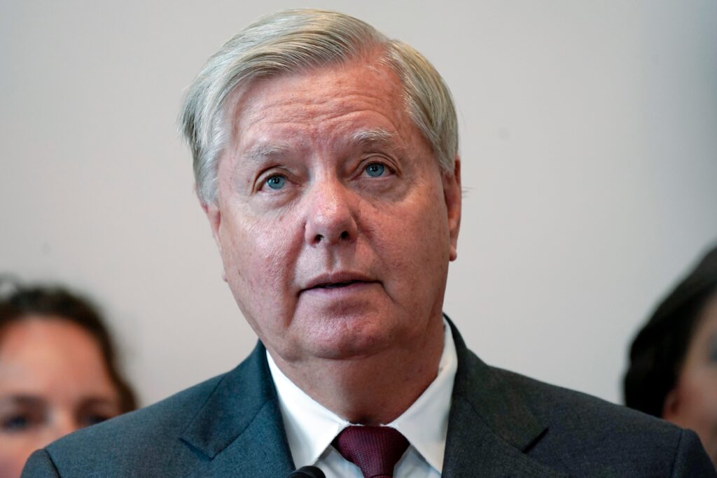 A Black Man Sips on Lindsey Graham’s Fake Tears For Herschel Walker