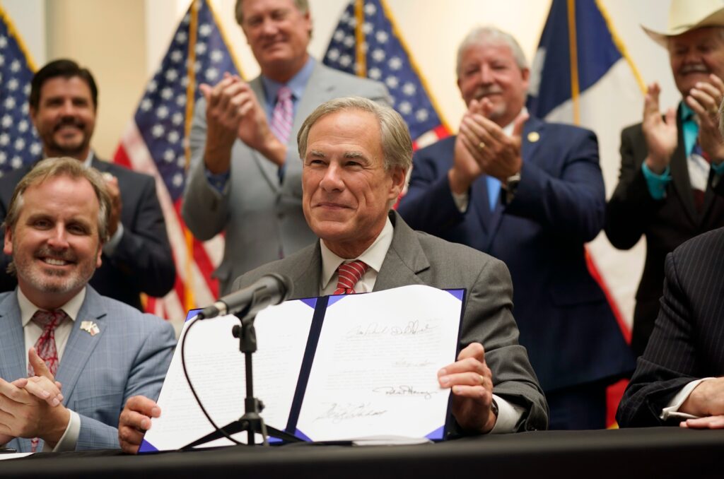 Texas Gov. Greg Abbott Signs Law Creating New Voter Restrictions as Advocates Sue in Federal Court