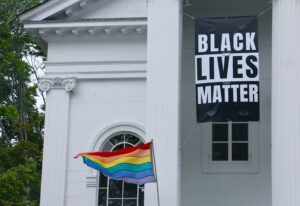 Bishop Strips School of Catholic Identity for Flying BLM, Pride Flags