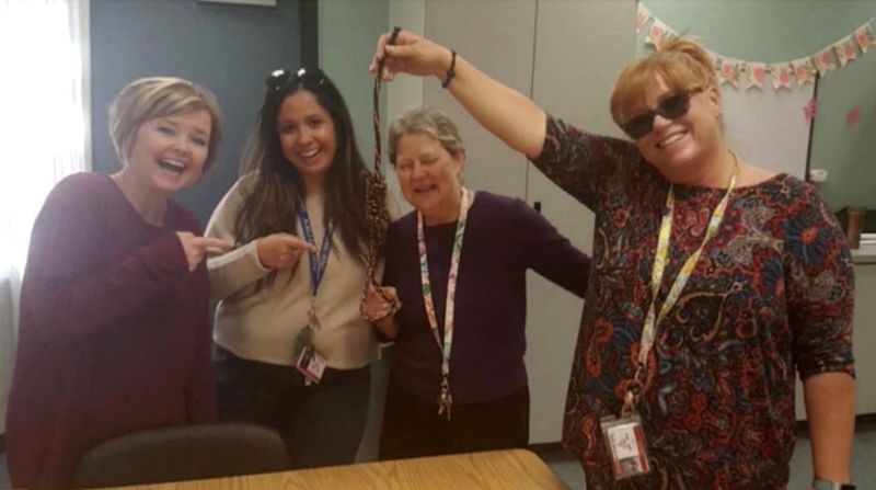 Picture of Smiling Teachers Holding Noose Lands All Four on Paid Leave Alongside Principal