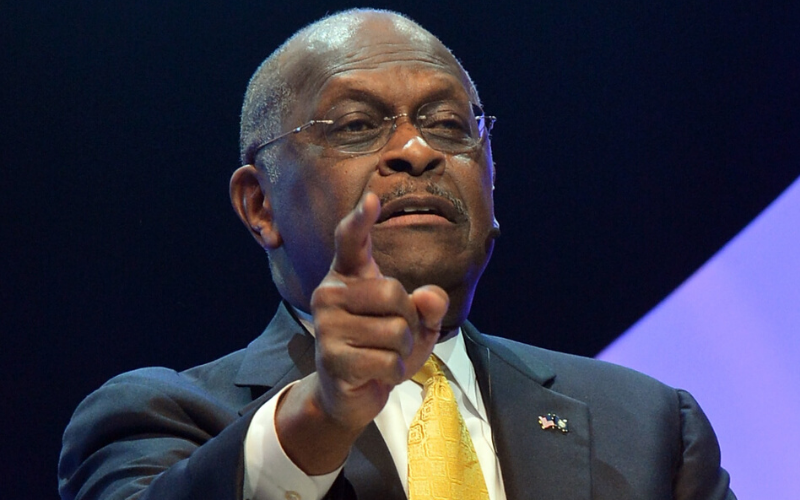 Herman Cain Hospitalized With COVID-19 After Posting Up at Trump Rally Without a Mask